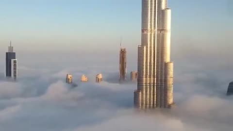 Burj Khalifa and Dubai Downtown are raising from the fog