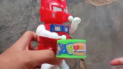 toy robot playing automatic drums