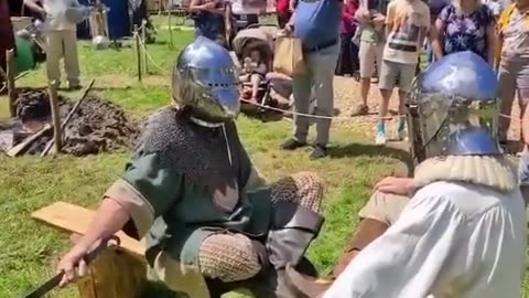 Funny people, medieval knights prepare for battle