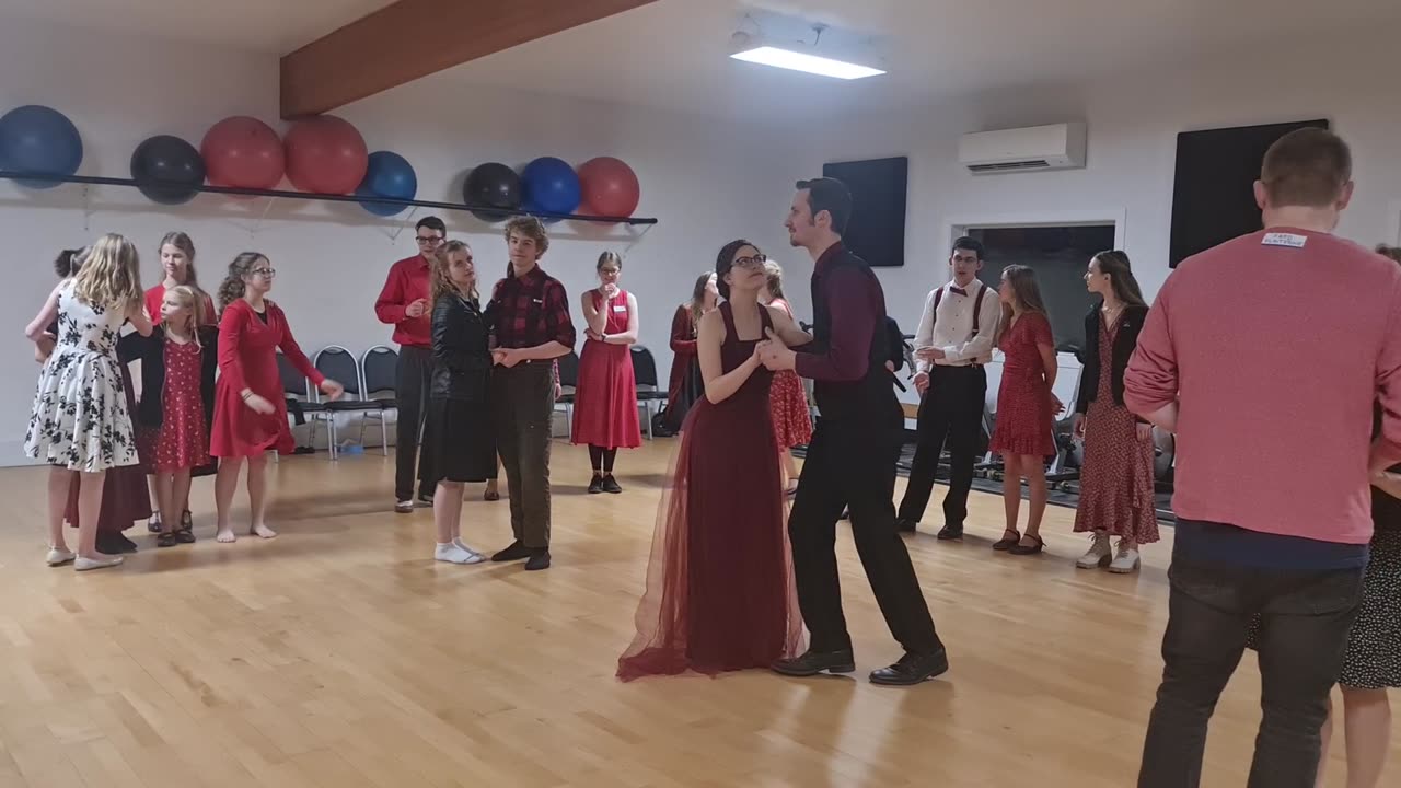 Red & Black Couples Stealing Dance