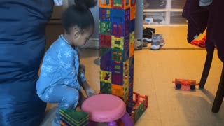 Girl Accidentally Knocks Over Tower She's Building