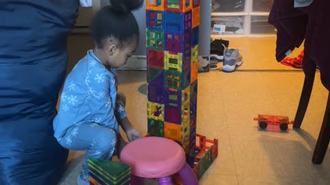 Girl Accidentally Knocks Over Tower She's Building
