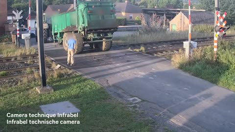 Moment train ploughs through trailer stuck on railway crossing