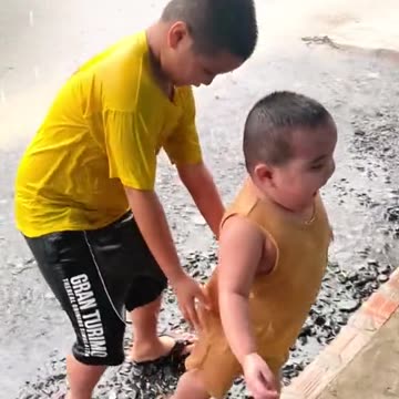 Children enjoying in the rain