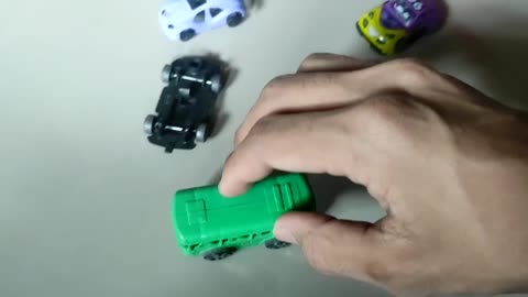 playing a green bus car toy