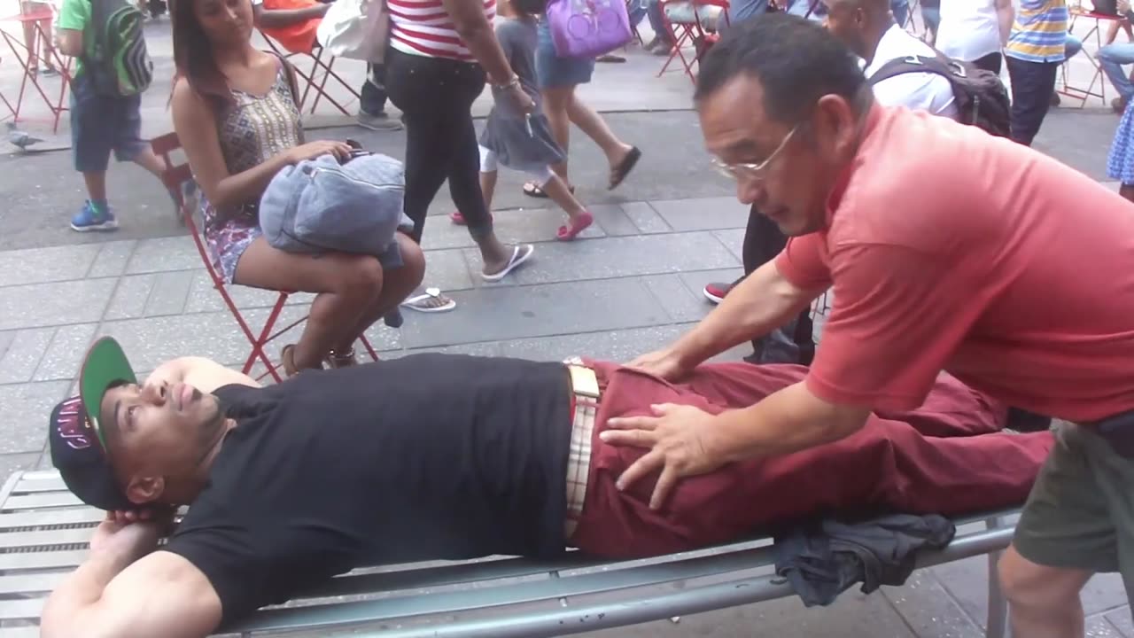 Luodong Massages Black Man On Metal Bench