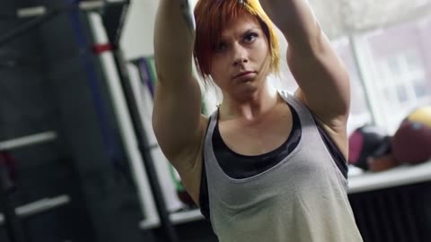 Woman swinging kettlebell