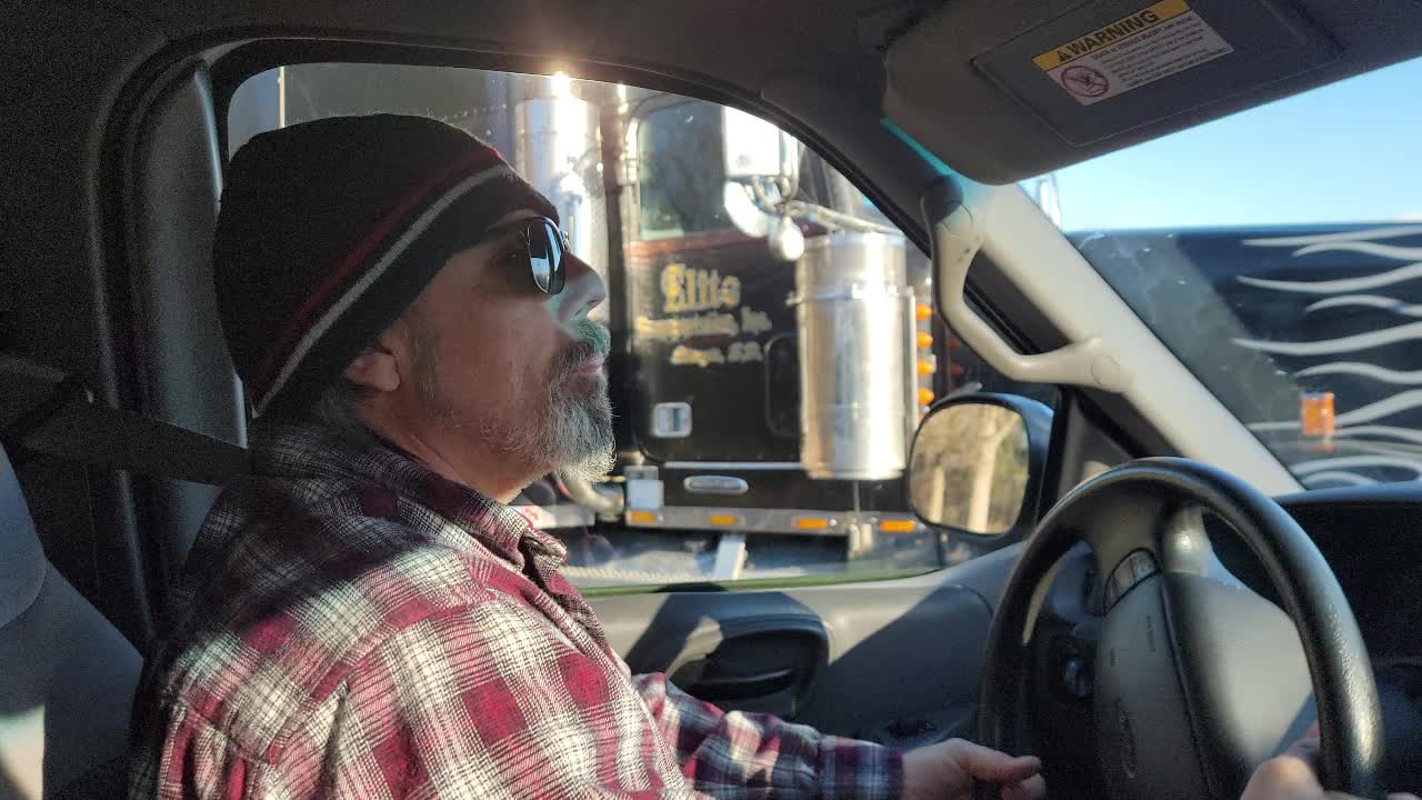 CHECKING ON THE FLAT BED TRAILER
