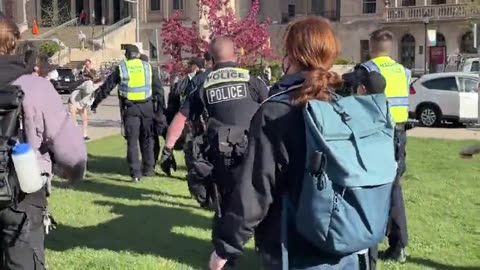 Students carried away by police at Univ of Wisconsin.