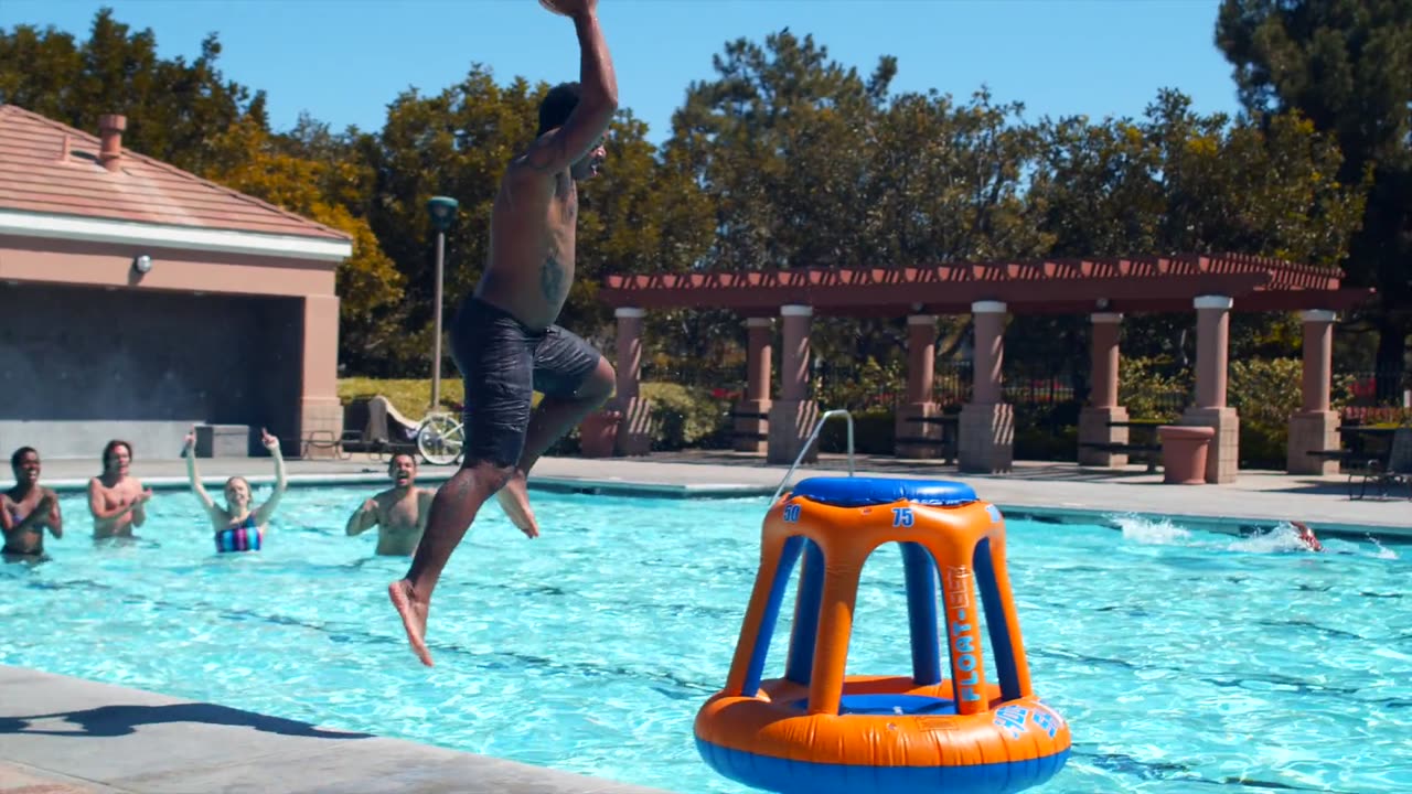 Man Makes Basketball Shot While Jumping In Pool