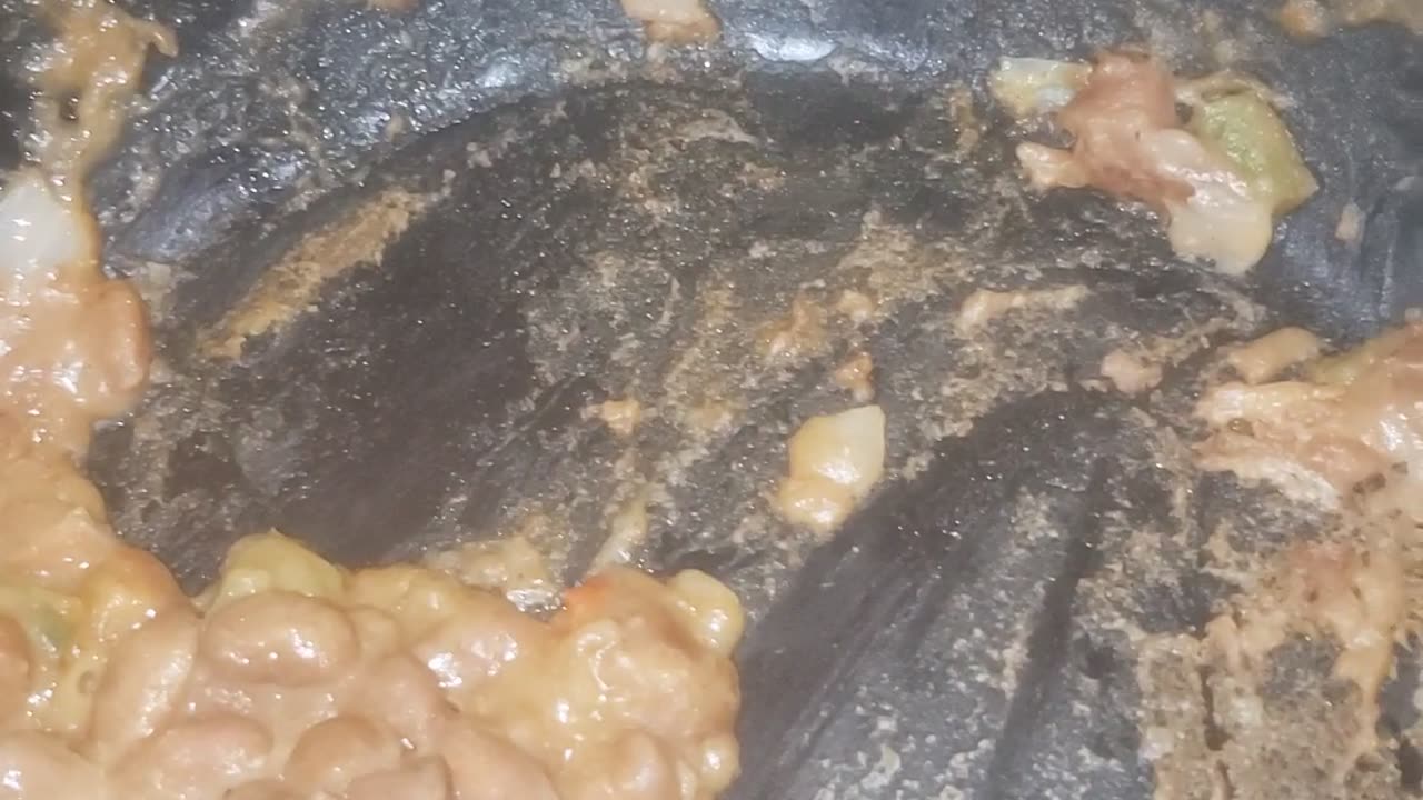 Left over beans with veggies shrimp with hotdogs sliced up in rice