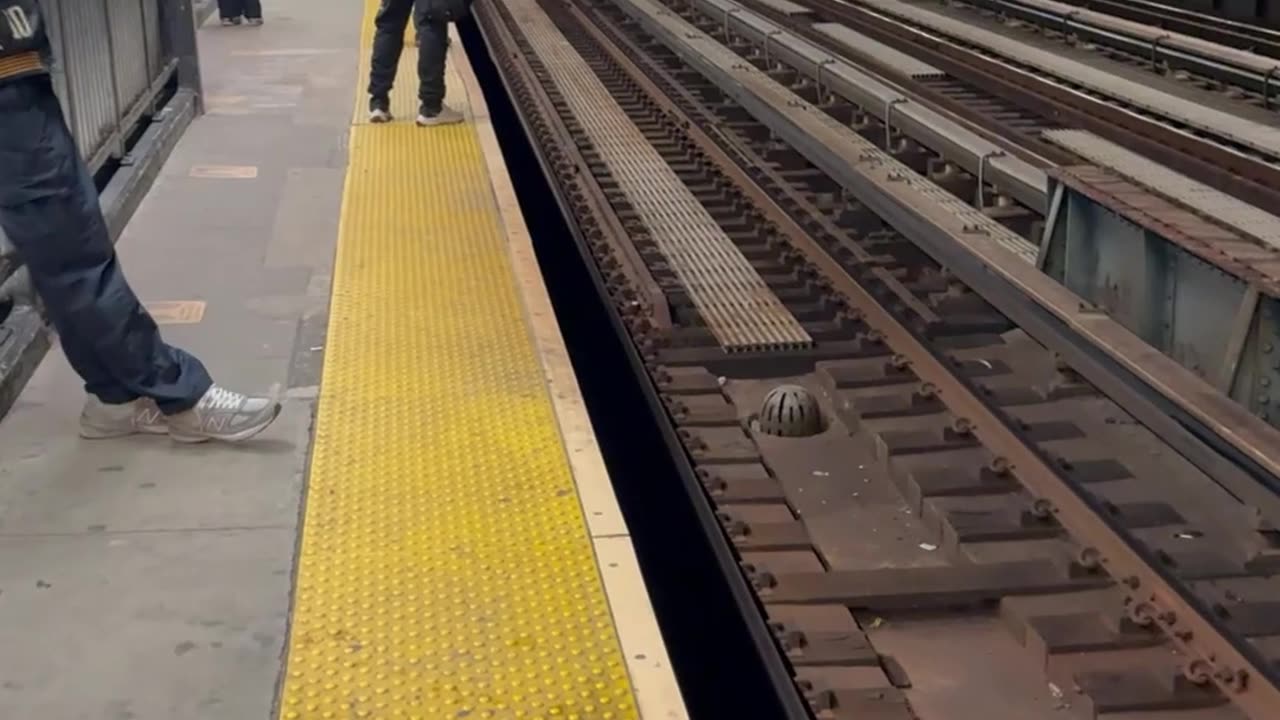 Man Walking Down Train Tracks