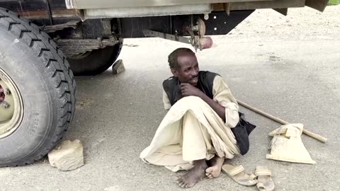 Sudan floods: stranded residents rope-climb to safety