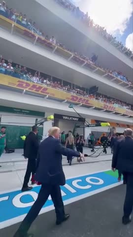 Trump Walks Out To A Huge Welcome At Formula One With USA Chants