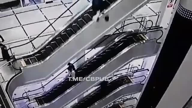 Insane Video of Someone Falling from a 4+ storey Escalator