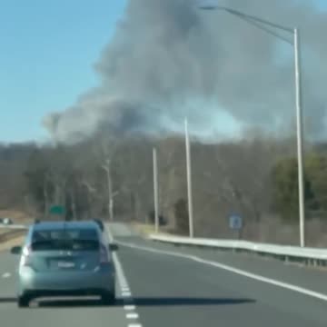 Multiple fire departments are responding to a massive three alarm fire