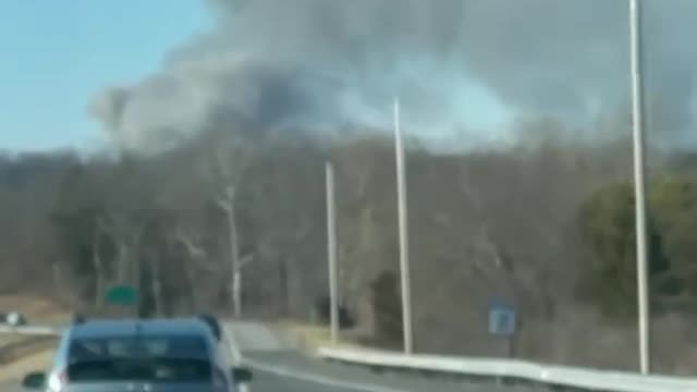 Multiple fire departments are responding to a massive three alarm fire