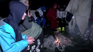 People in Turkey try to stay warm after deadly quake