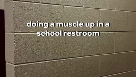 doing muscle up in a school restroom