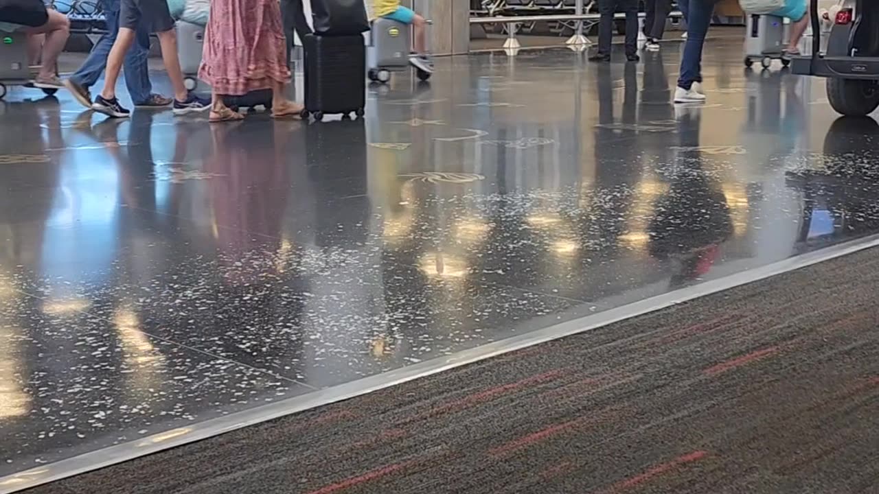 Family Rides Scooter Suitcases Through Airport