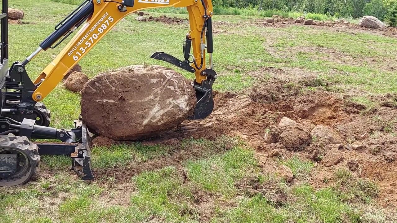 2 Ton Excavator Digs Out 3,000lb Rock