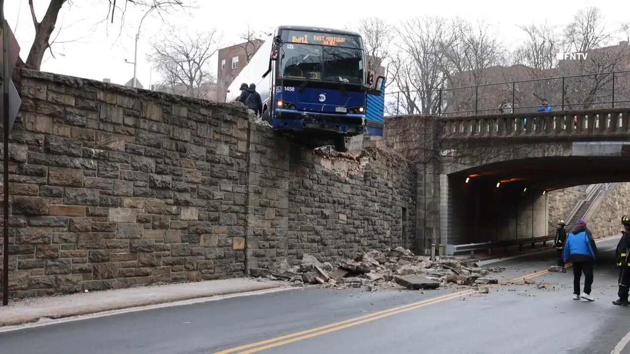 New York City MTA Bus Hangs Precariously Off Overpass Following Collision