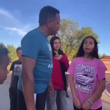 A father slaps a little after she insulted his son