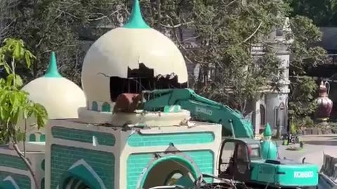 Bulldozers in India demolish illegal mosques.