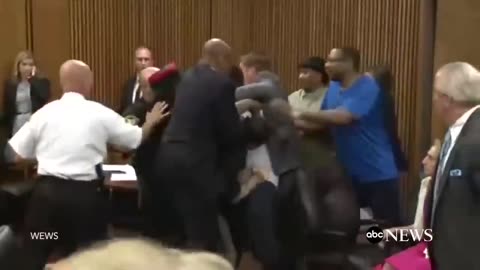 Dad Jumps Over Table To Attack Daughter's Killer On Court