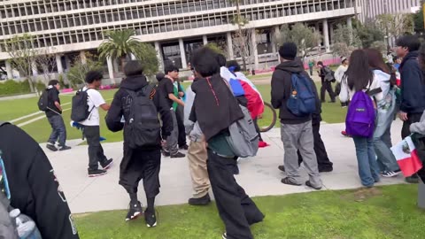 A mob of Mexican nationalist youths protesting against American border security