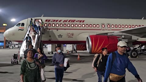 Graceful Arrival: Passengers Deboarding the Plane