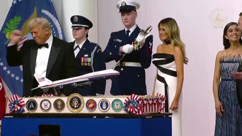 Trump dances with a sword at the Commander in Chief Ball