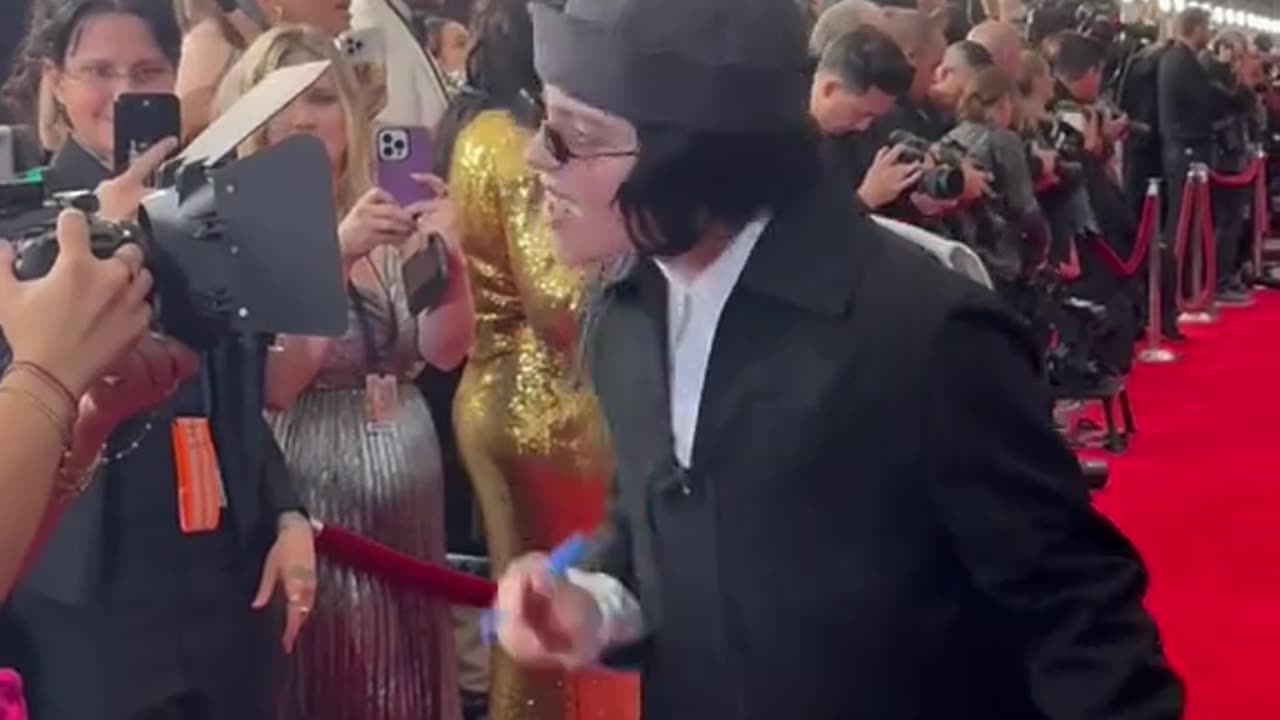 Having selebs sign a camera lens at the# Grammys# 1 million views and subscribe