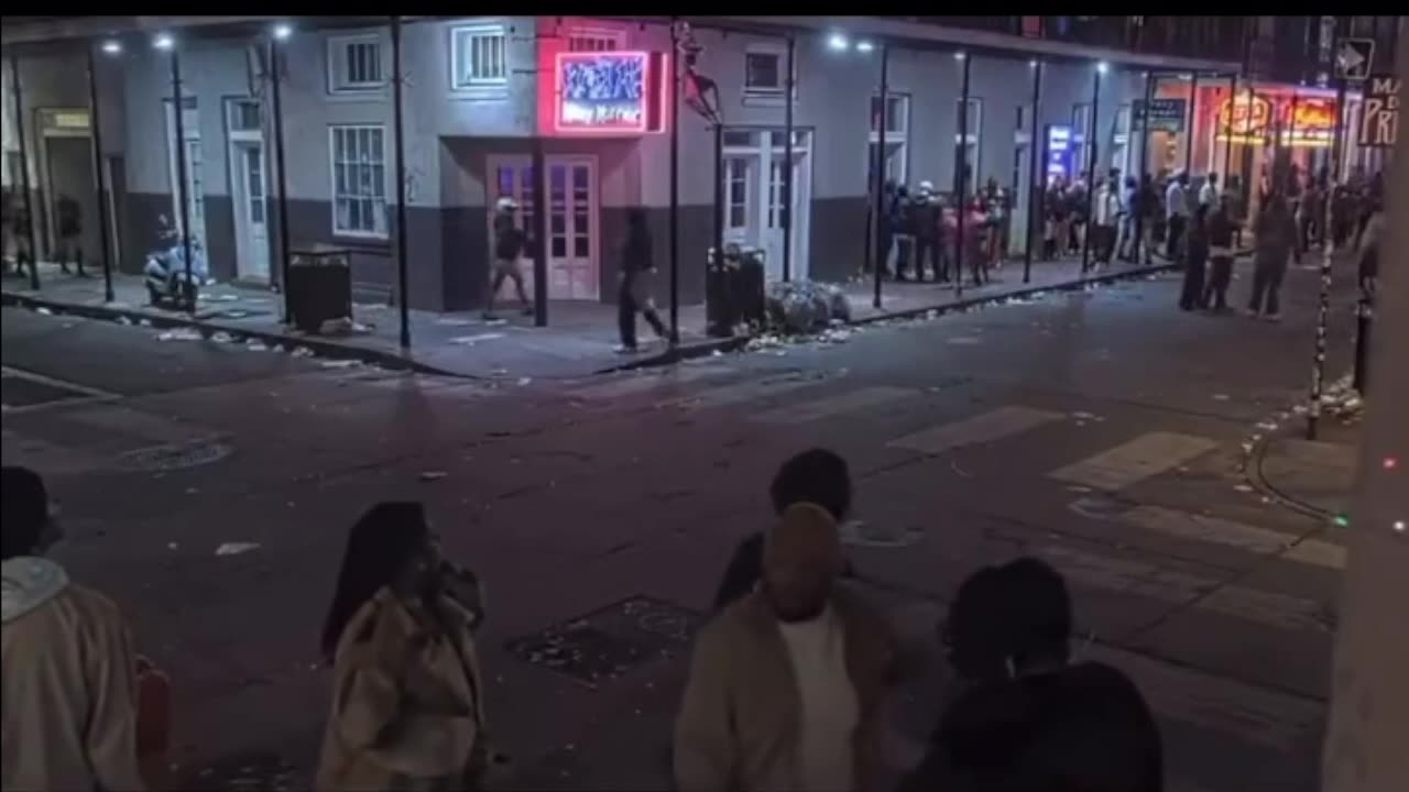 Brave New Orleans Police Officers run towards the chaos on Bourbon Street.