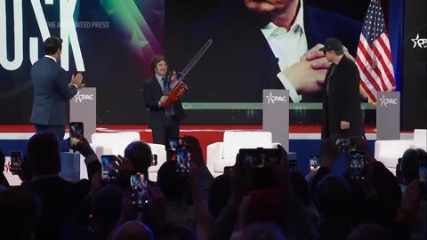 WATCH: Elon Musk waves chainsaw on stage at CPAC