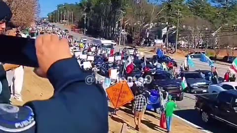 WATCH as pro-illegal immigration protesters waving foreign flags block traffic in Atlanta, GA.