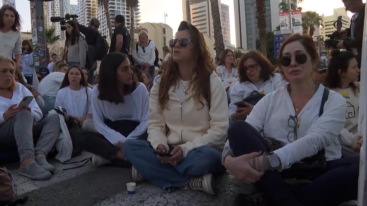 Families of those taken hostage by Hamas stage silent protest in Tel Aviv