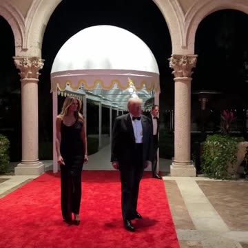 President Donald J. Trump and First Lady Melania Trump walk the red carpet at Mar-a-Lago on New Year's Eve.