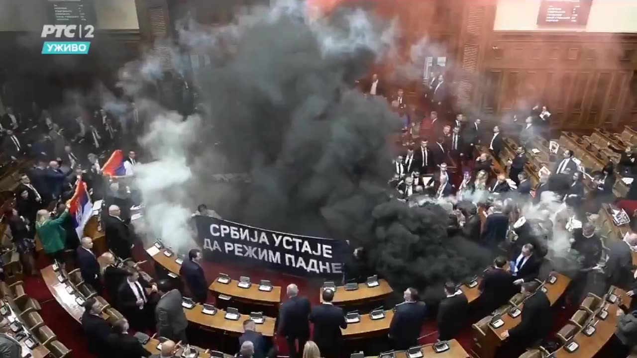 💥Fighting erupts in the Serbian Parliament complete with Smoke Bombs