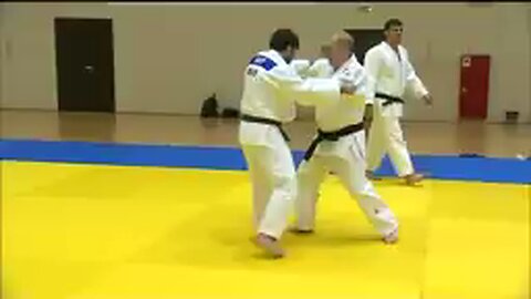 Black belt Putin shows off judo moves with Olympic athletes