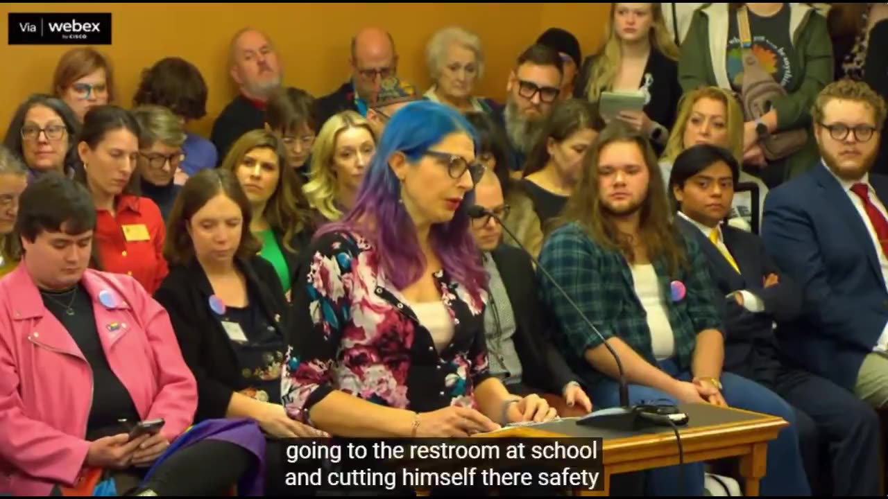 “Two of my children are receiving gender affirming care” - purple/blue haired