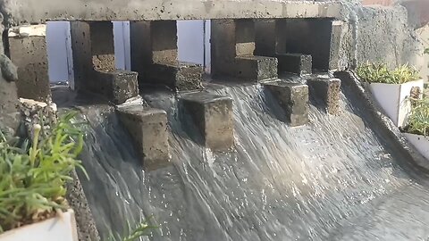 Mini gravity dam water discharge