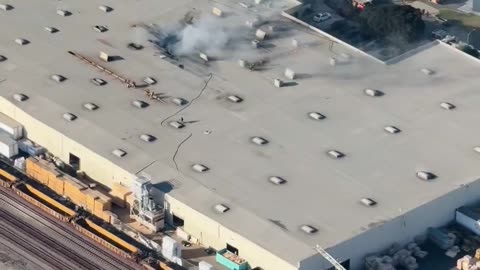 BREAKING: A small plane has crashed into a commercial warehouse