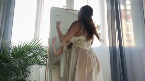 Transparent Cleaning the mirror with Wowa 