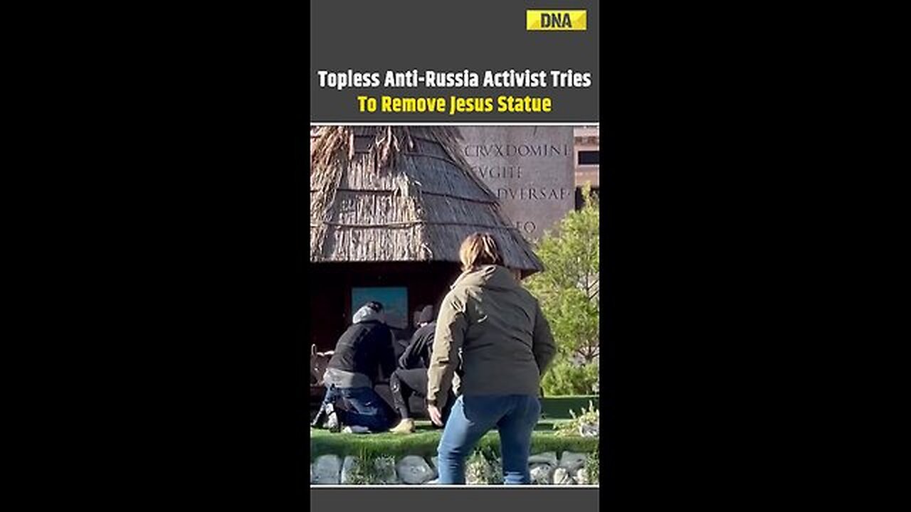 Topless Anti-Russia Activist Tries To Remove Jesus Statue From Vatican Crib #vatican #russia