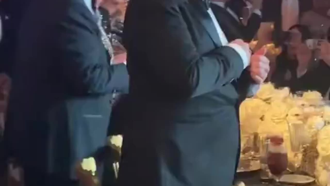 What do you notice in this video of Trump and Musk at last night’s New Year’s Eve party ?