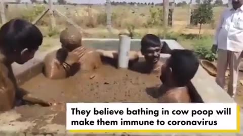 indians bathing in sht