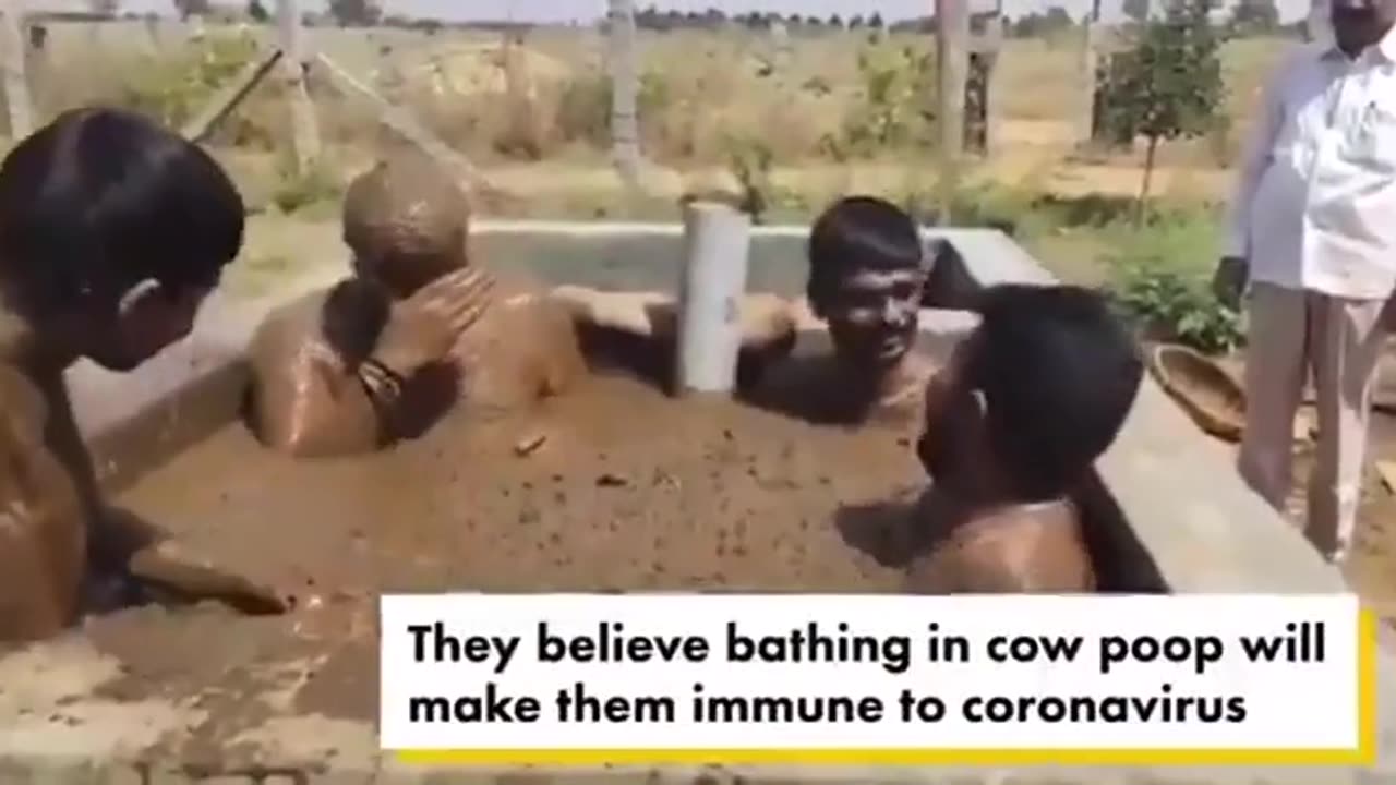 indians bathing in sht