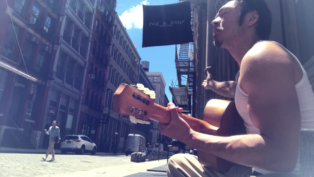 Store Manager Encourages Street Musician