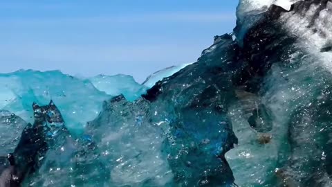 Watch an Iceberg Flip in the Glacier Lagoon 🤩🤗